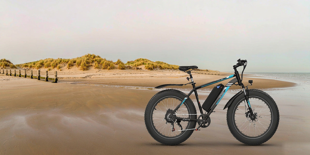BK15 4.0 fat tyre electric bike on a British coastal beach — desktop banner